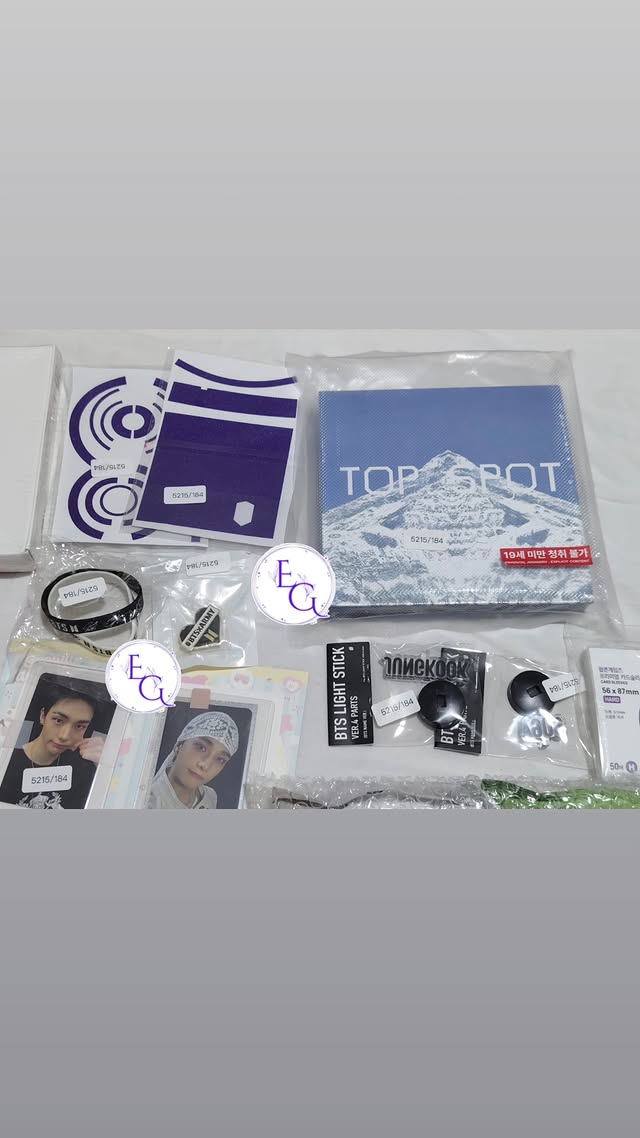 TOP SPOT album with light stick parts and photocards flatlay
